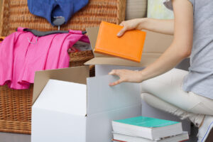 Woman sorting and packing belongings