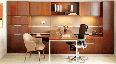 large clean office with wooden cabinets and desk